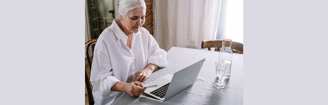 Older woman looking at her laptop